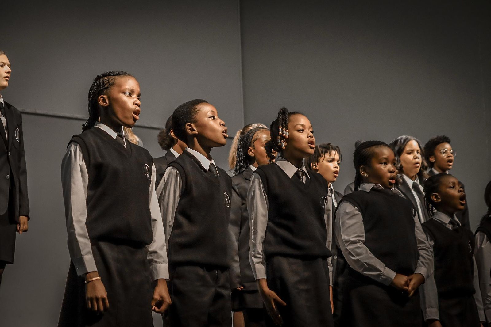 Choir students singing in a row